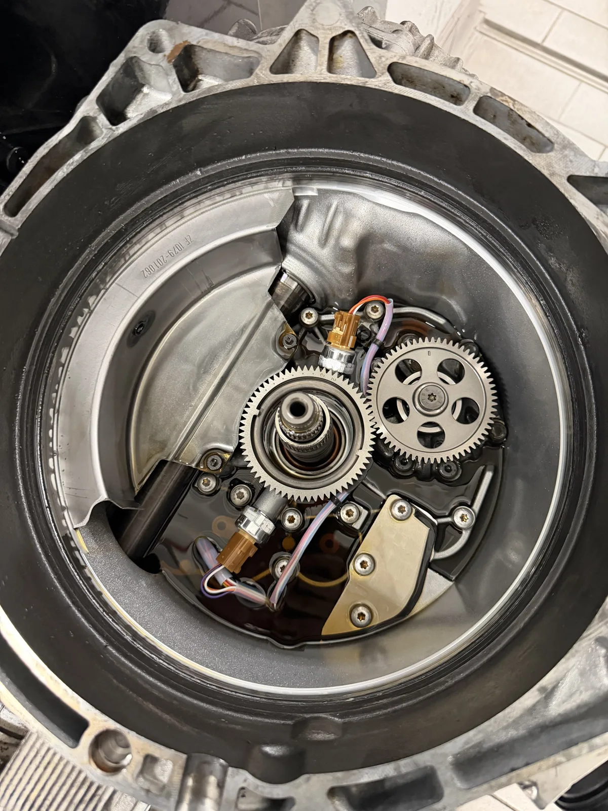 718 Cayman S PDK bell housing with the clutch removed, showing the pump drive gears and sensors